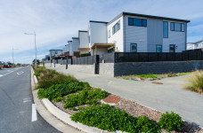 [image] a street with housing down one side